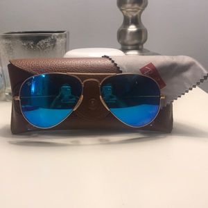 Blue lensed aviator Ray bans
